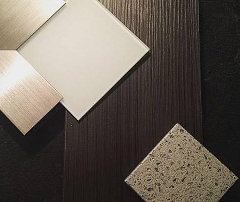 Textured wood veneer with stainless doors and painted glass inserts